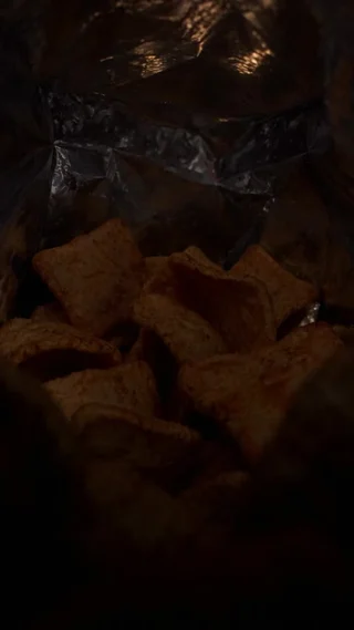 A point of view from inside an open bag of snacks